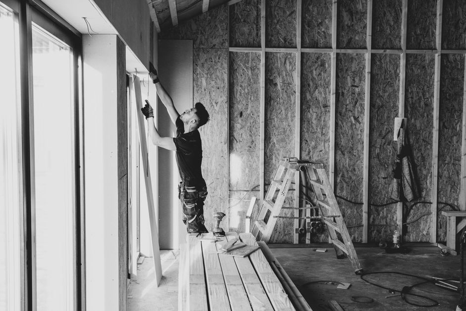 Contractor preparing for professional window installation